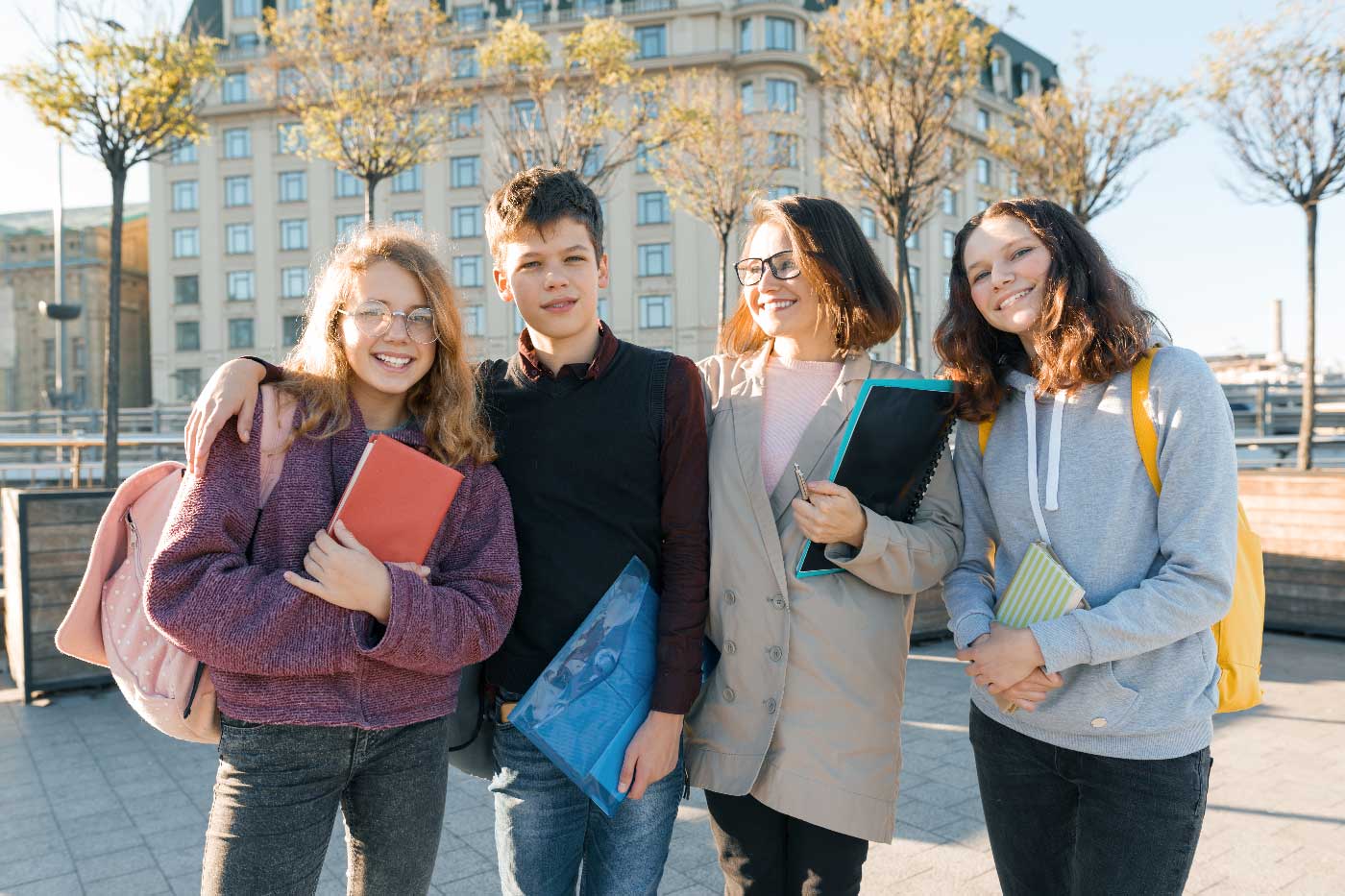 outdoor-portrait-of-a-female-teacher-and-group-of-2024-12-08-01-28-28-utc